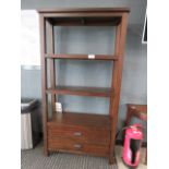 A dark wood open fronted bookcase with two drawers under