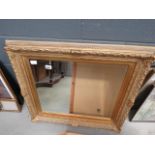 Rectangular bevelled mirror in decorative gilt frame