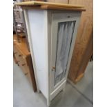 Cream painted pine cabinet with fabric panel and drawer under