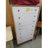 White painted narrow g plan chest consisting of 7 drawers