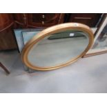 (5465) - Oval bevelled mirror in gilt frame, plus two impressionist prints