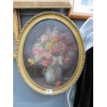 Oval framed oil on board of vase and flowers