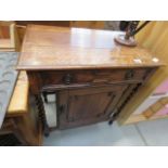 1920's oak single door cupboard with barleytwist supports