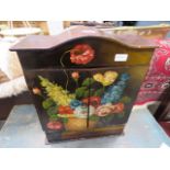 Table-top double door cupboard with painted floral pattern and drawer under