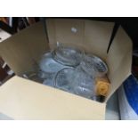 A box containing a quantity of glass bowls and dishes