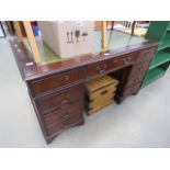 5300 - Reproduction mahogany twin pedestal desk with green leather surface