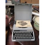 Silver travelling type writer