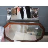 Shield shaped bevelled mirror plus a mirror in walnut frame