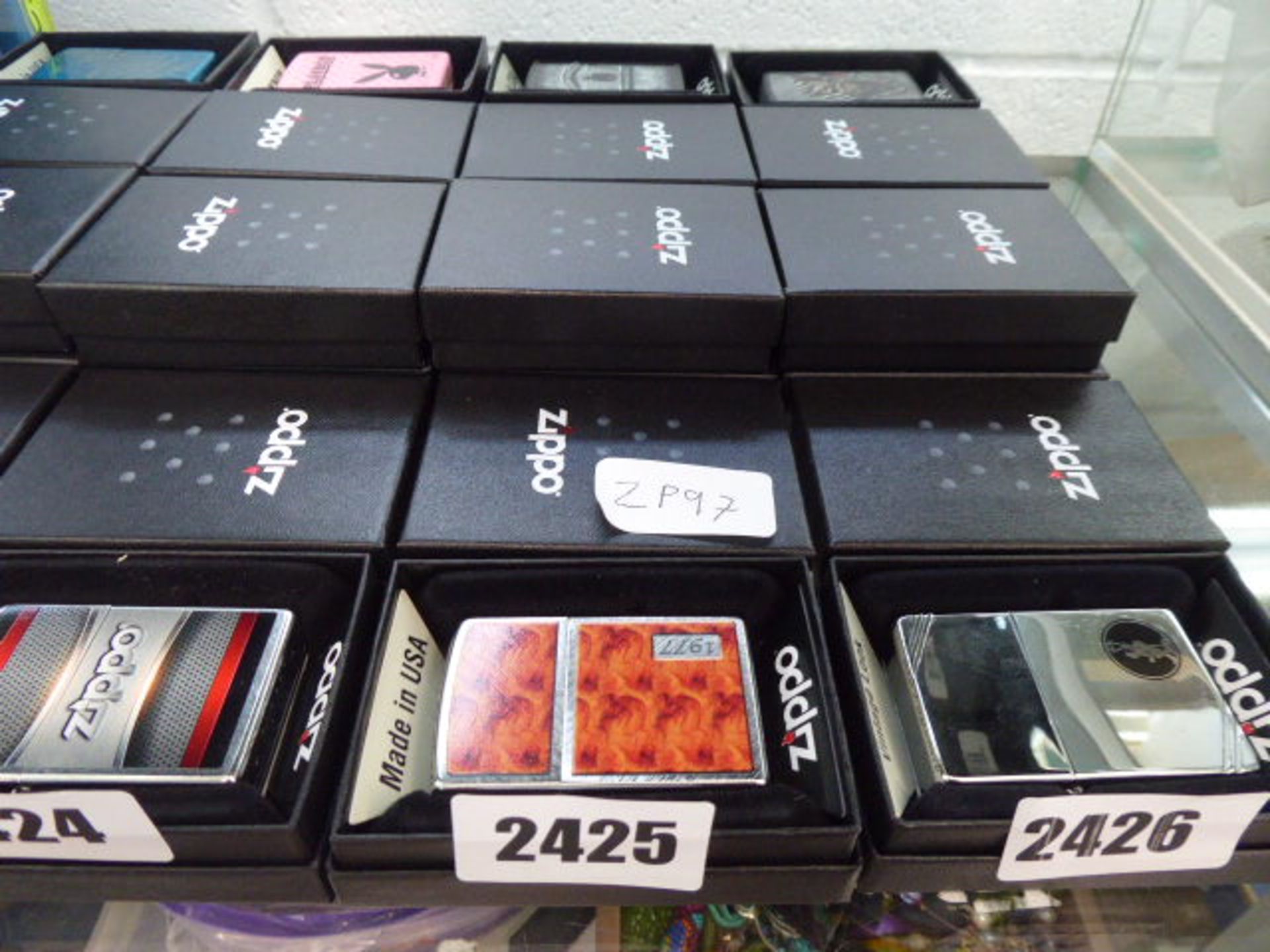 8 boxed novelty Zippo lighters