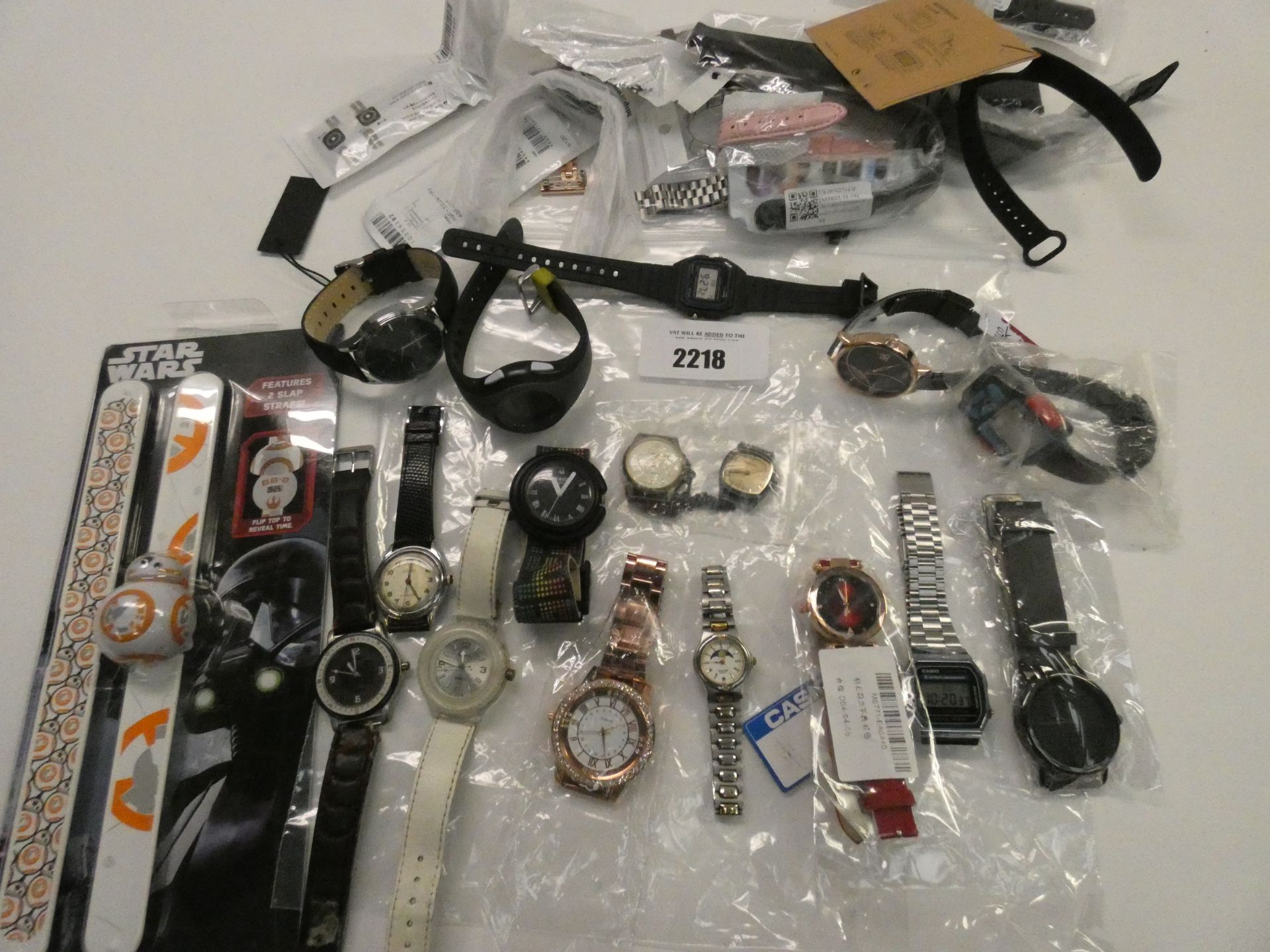 Quantity of various wristwatches and straps