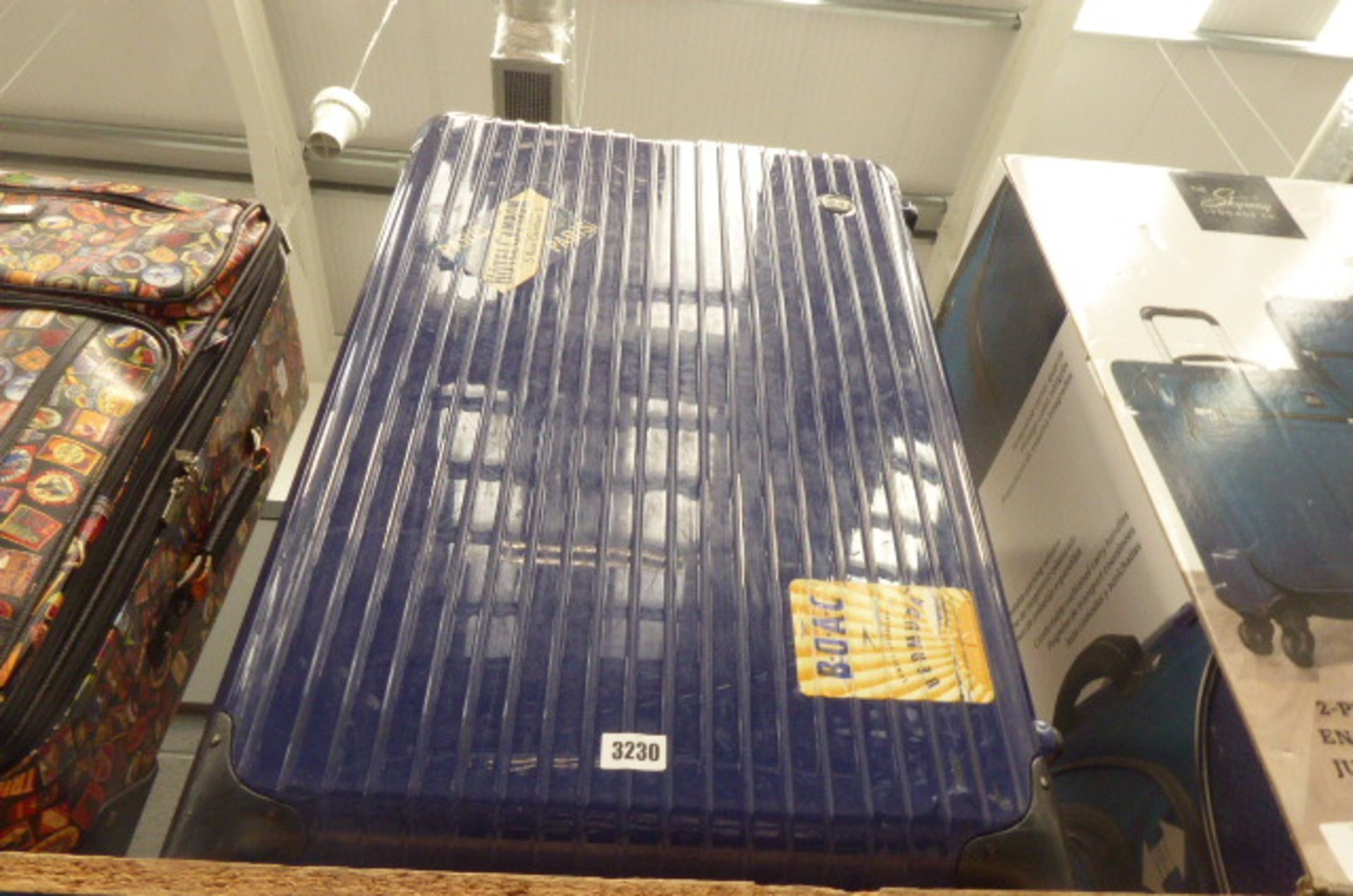 Large hard shell blue suitcase