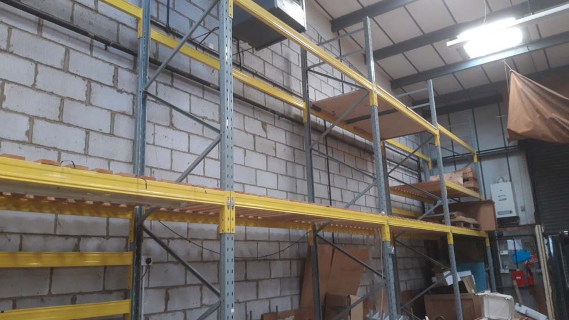 4 running bays of bolt less pallet racking to include; Five 6m uprights and Thirty 2.7m cross