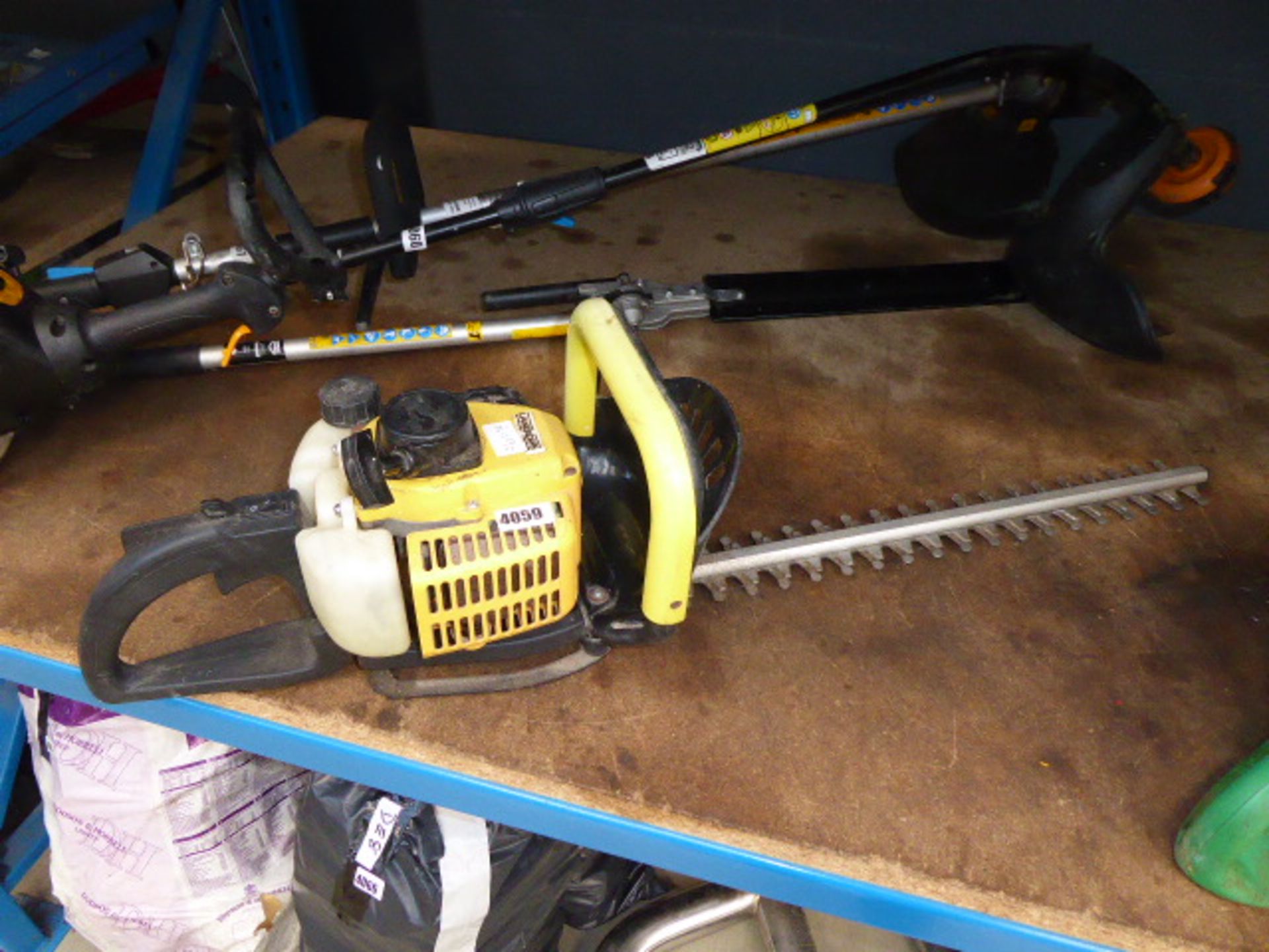 Landscape yellow petrol powered hedge cutter