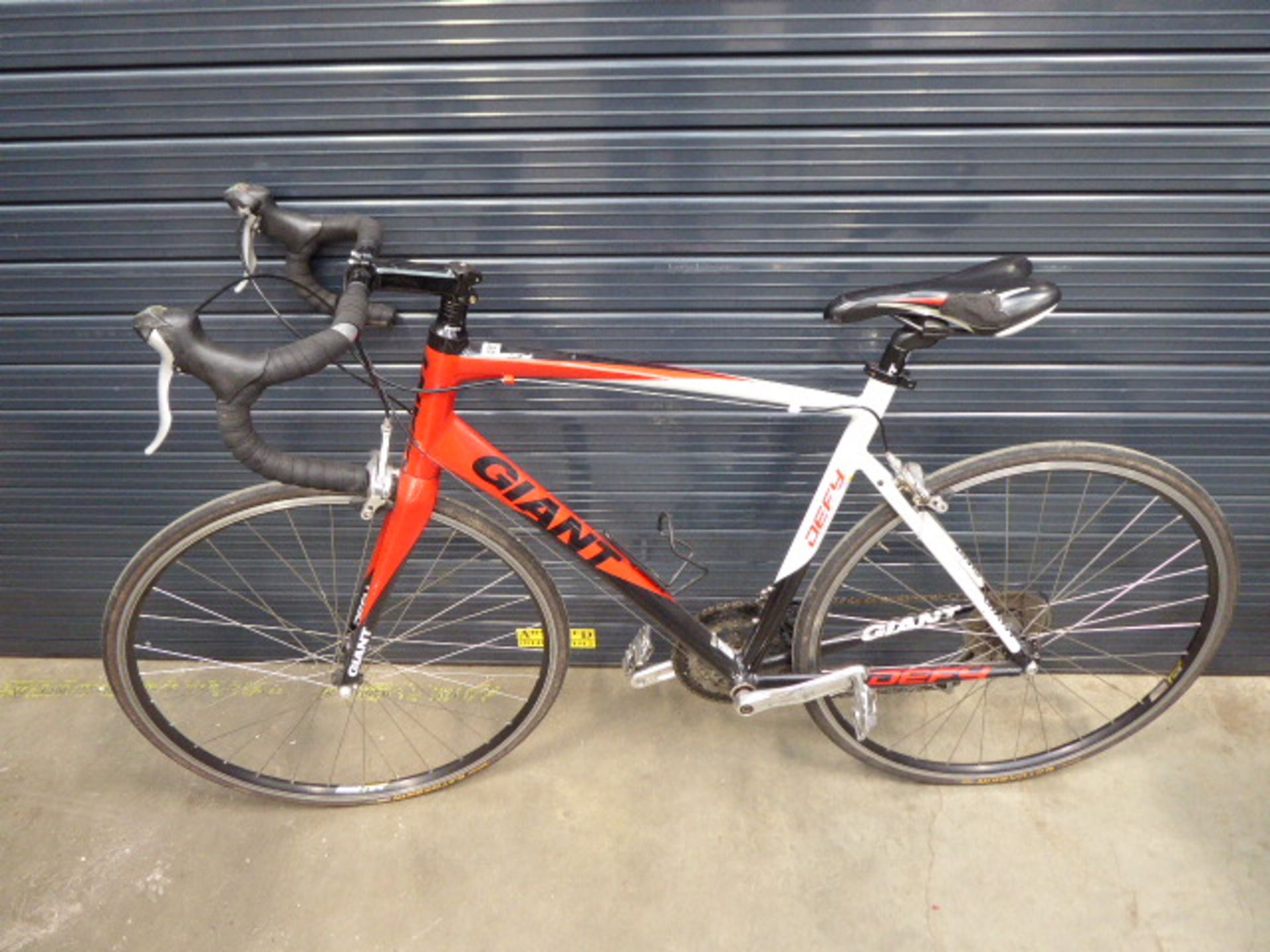 Red, white and black Giant racing bike