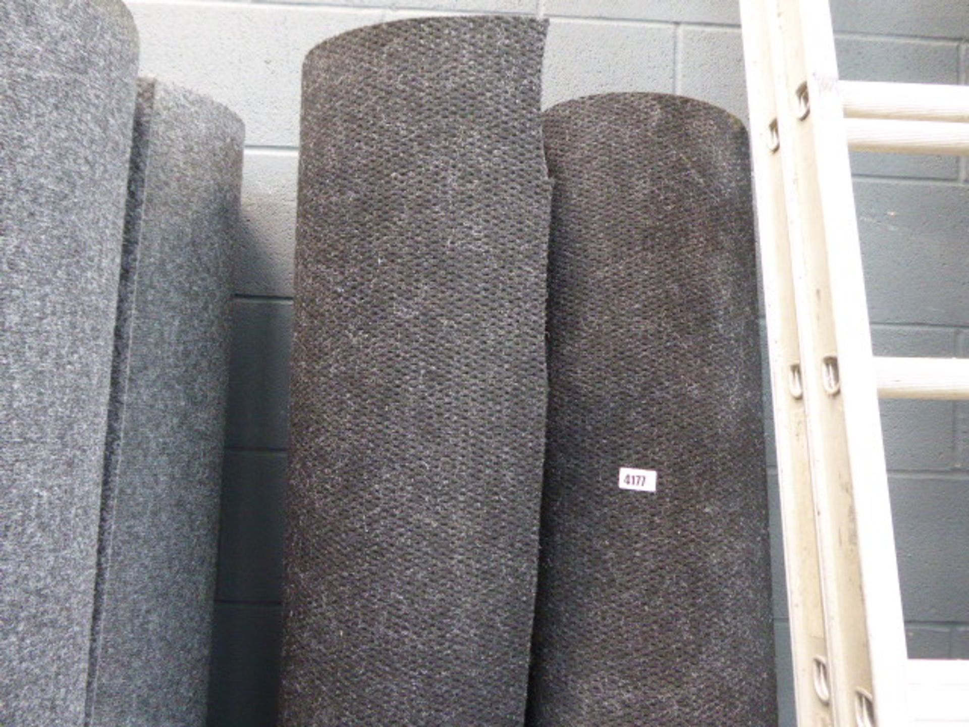 2 Black industrial style carpets approx. 8 m each