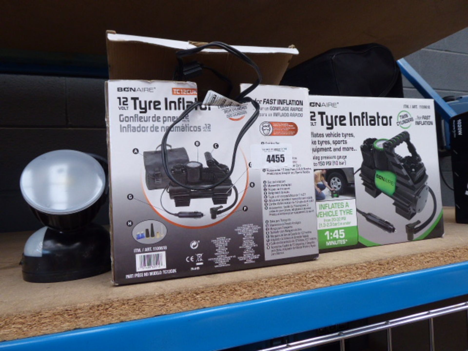 3 boxed and 1 unboxed tyre inflator and a security light