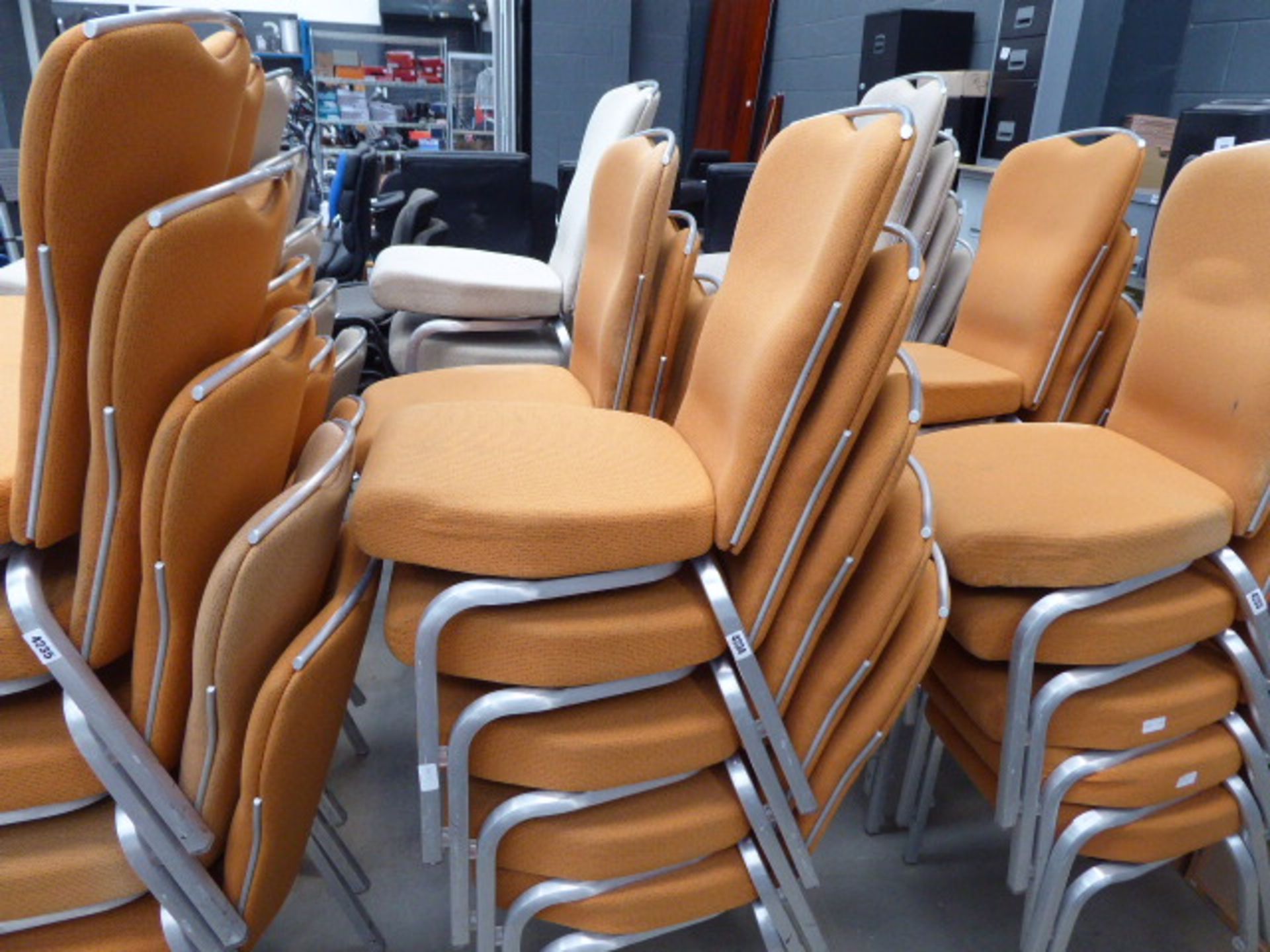 10 orange cloth metal framed stacking chairs