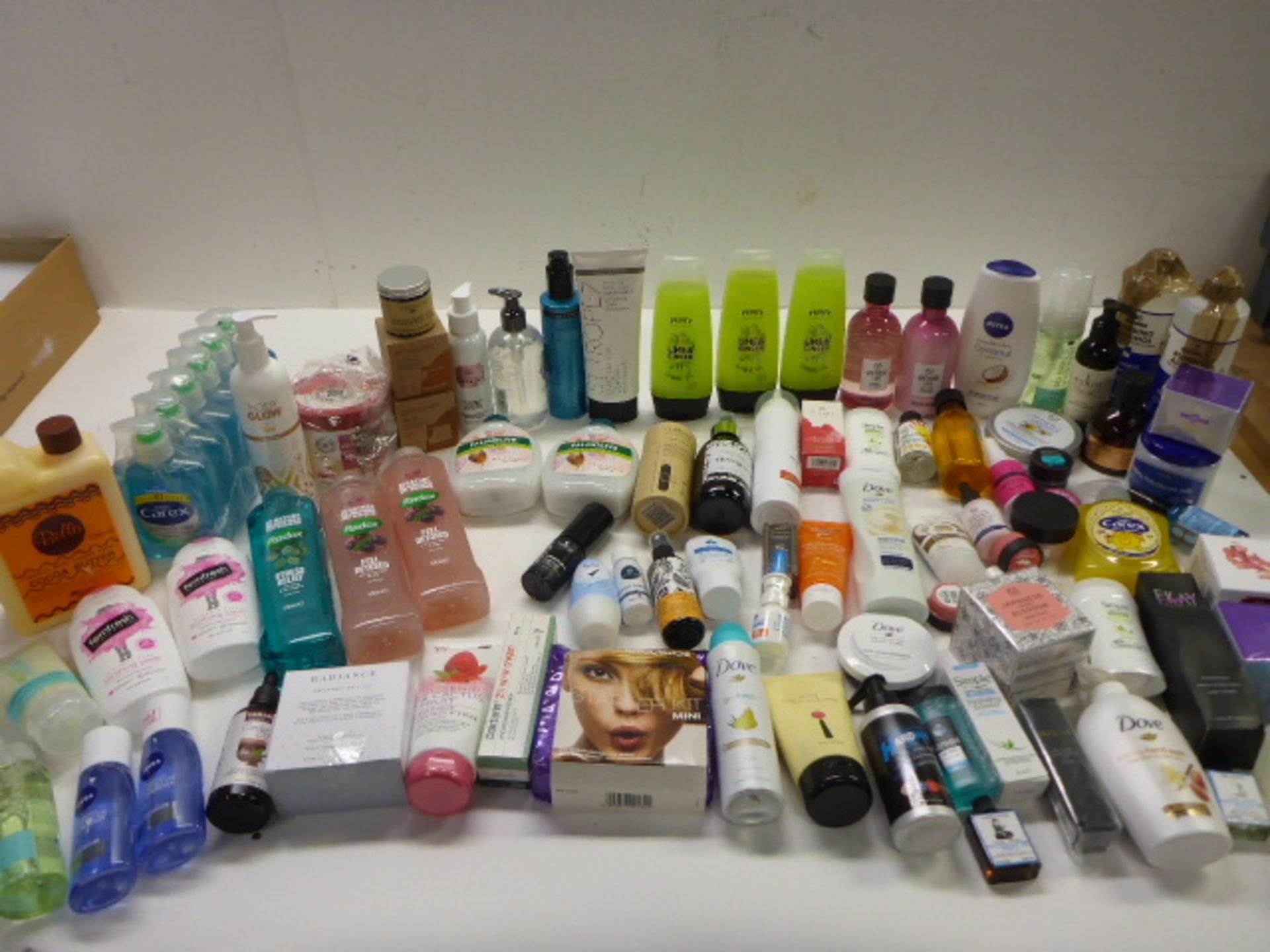 Large bag of toiletries including toothpaste, hand wash, shower gel, moisturizer, deodorant, self