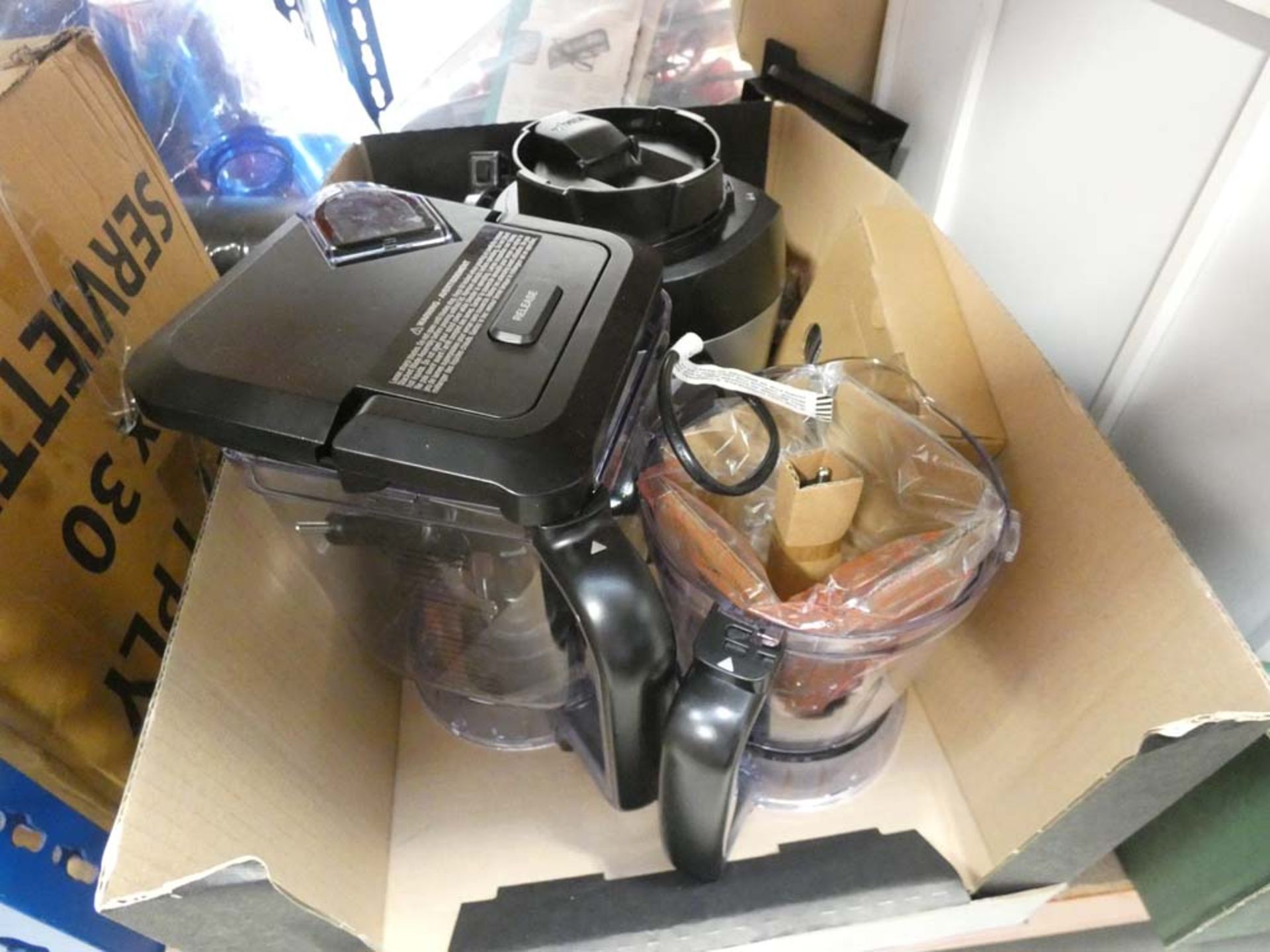 Box containing a Ninja blender with attachments plus another box containing a Bosch coffee dispenser