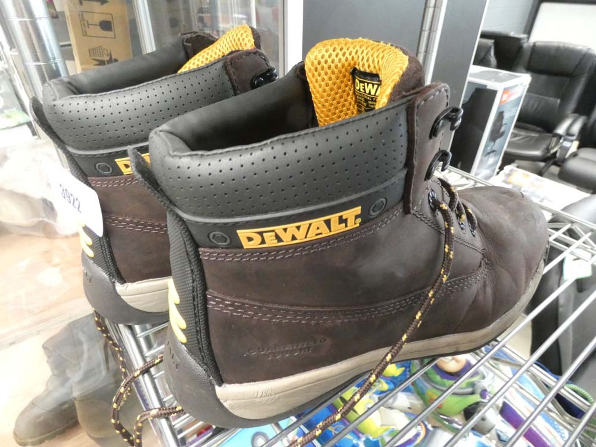 Boxed pair of Skecher shoes and pair of Dewalt boots