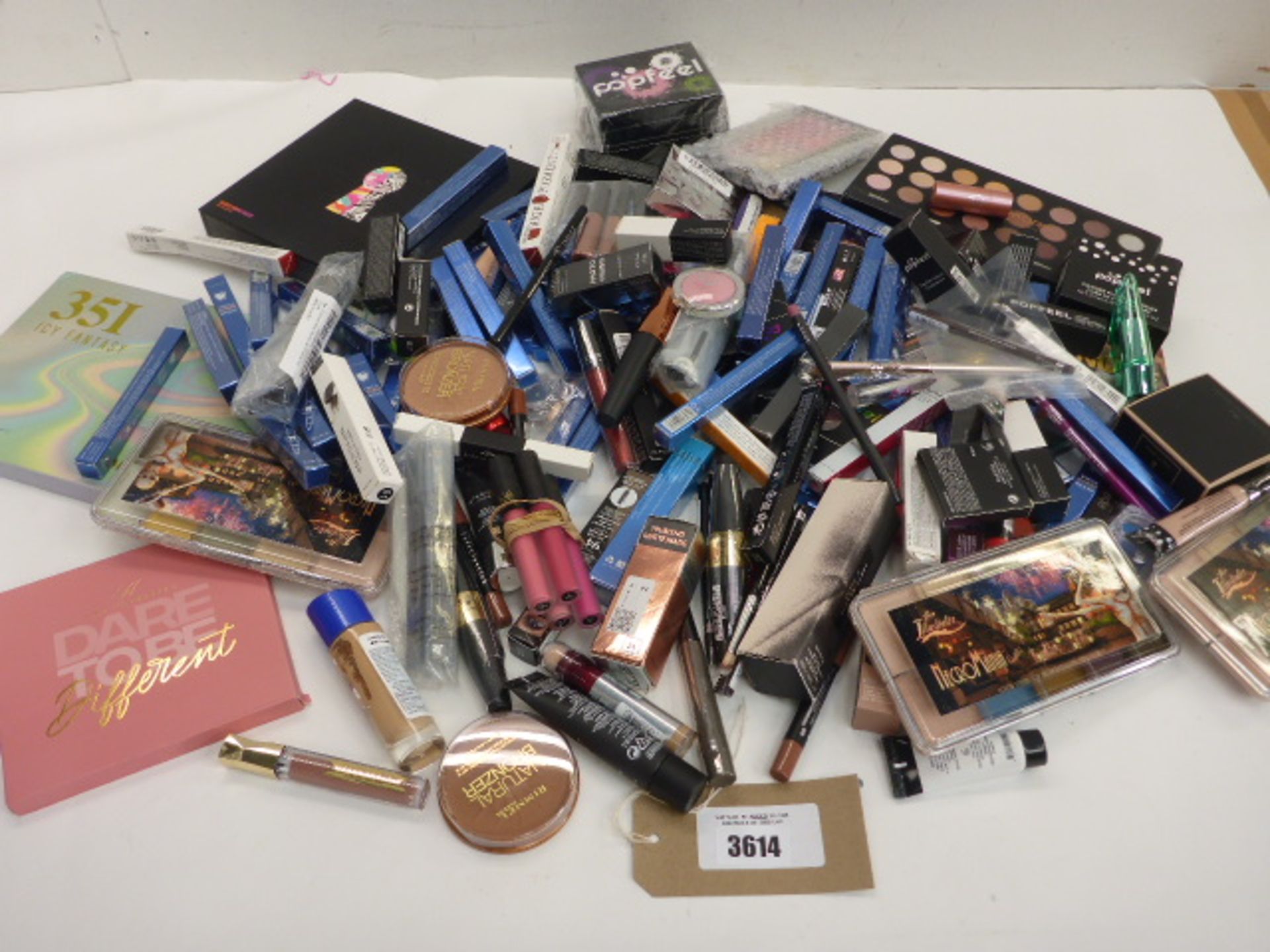 Large selection of assorted cosmetics including Rimmel, Max Factor, Fenty and others