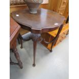 Circular topped occasional table with shelf under