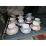 A cage of assorted collactables Colclough (Harlequin plus one other pattern), tea cups etc