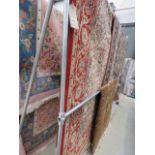 12 - Large carpet in red, blue and beige with floral and geometric pattern