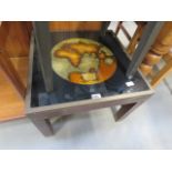 A metal banded coffee table, with glazed top of map of the world