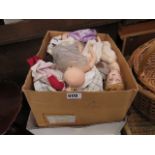 Two boxes of assorted dolls