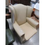 Cream leather winged back armchair