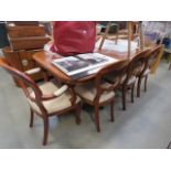 Teak oval dining extending table on tripod supports with 8 matching kidney back chairs with beige
