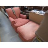 A single armchair in coral pink with floral chequered pattern and matching footstool *Sold subject
