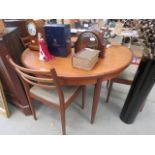 Circular G-Plan teak extending dining table with 4 matching chairs