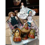 Fifteen dolls in a wicker basket
