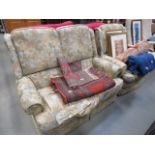 Two seater sofa with floral fabric and matching single armchair