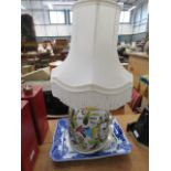 A large blue & white platter and florally decorated lamp