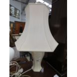 Table lamp with white base and cream shade