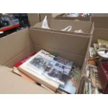 Two boxes of assorted items to include candlesticks, candles, candle holders and a box of books