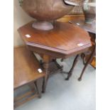 Occasional table with hexagonal top and fretwork shelf under