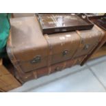 A pair of wood banded travel trunks