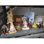 A cage of assorted items, to include: paperweights, christmas figurines, The Final Courtesy book and