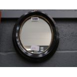 A small oval mirror