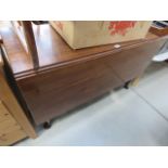 5002 - A dark wood drop-leaf table