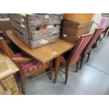 A teak dining extending table with matching candy stripe chairs *Sold subject to our soft