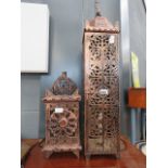 A pair of fretwork ornate copper effect lanterns