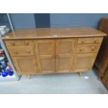 An Ercol 351 elm and beech sideboard