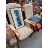 Pair of high backed easy chairs with floral fabric and wooden supports