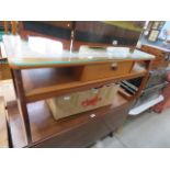 A teak coffee table with single drawer under