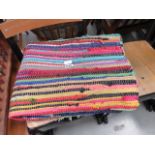 Multi-coloured woven throw